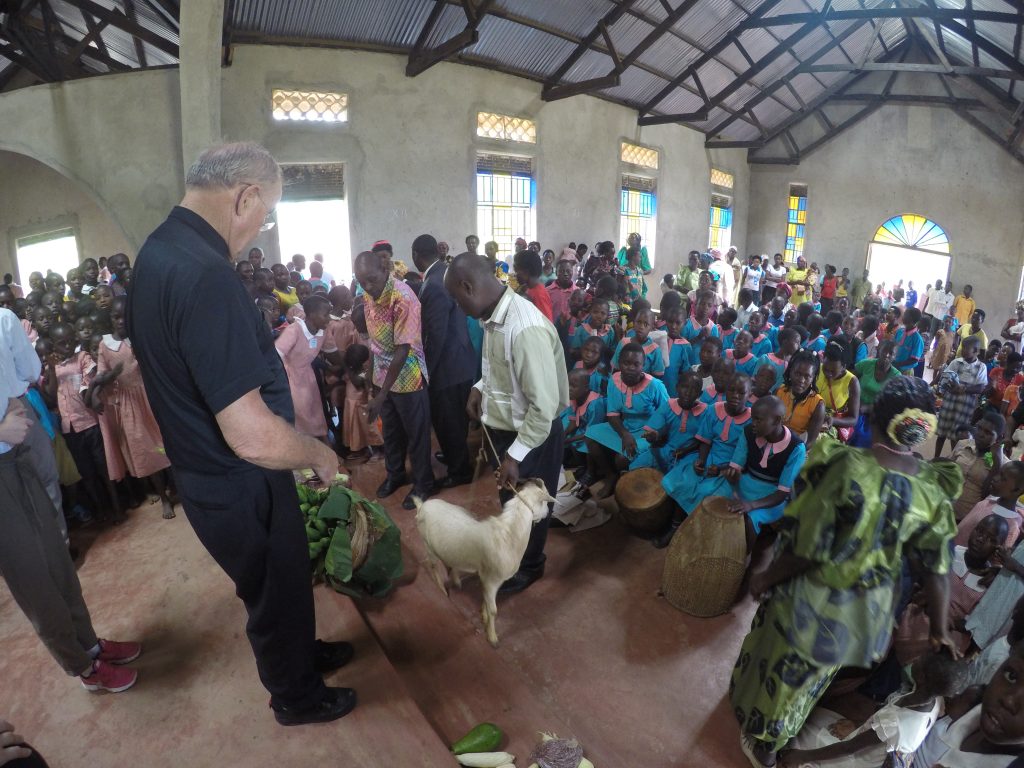 priest accepts goat inside church